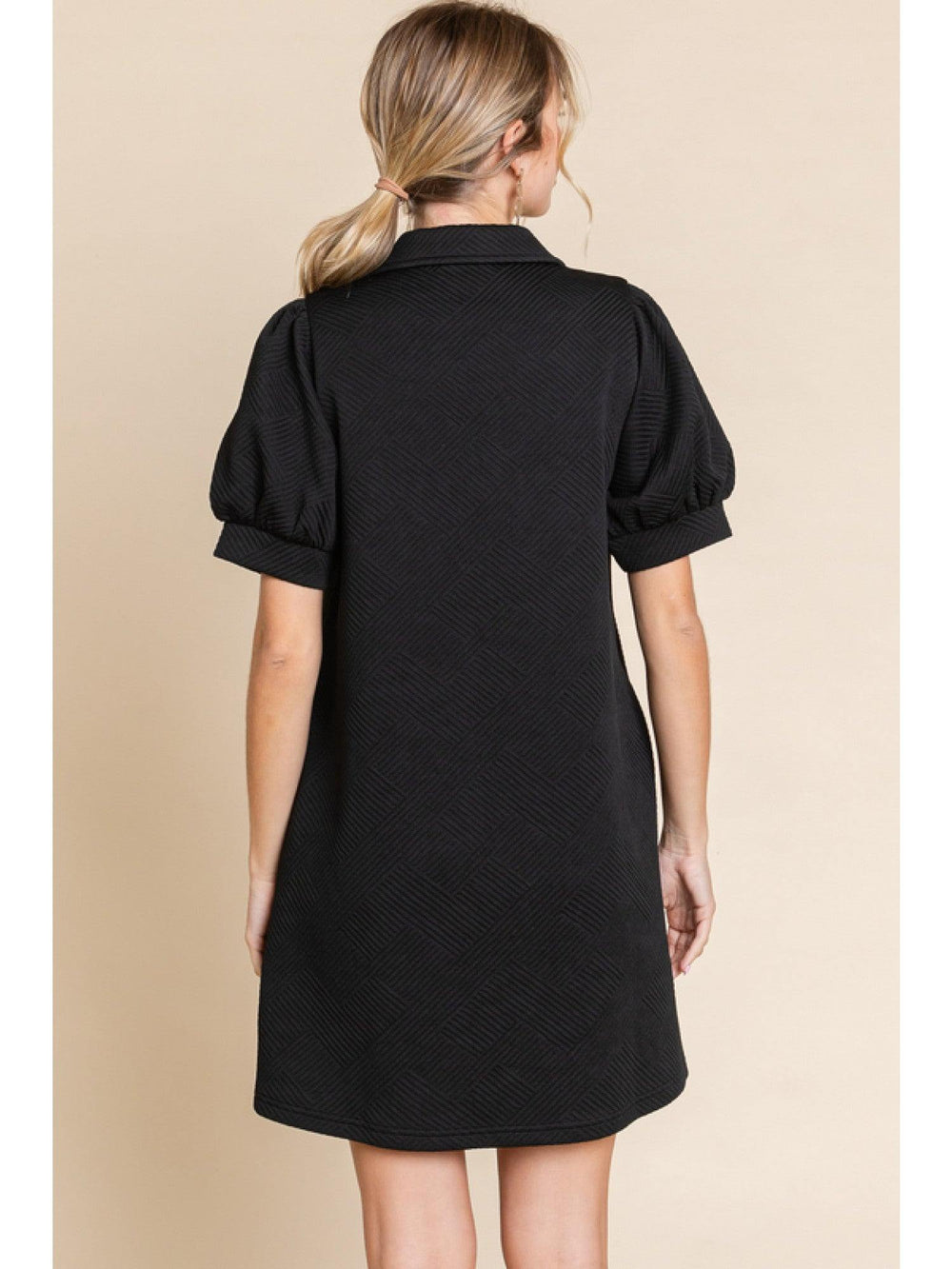 Textured dress with open collared neck, side pockets, and short peasant sleeves, and band cuffs.