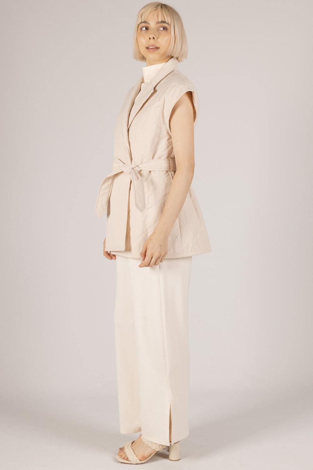 cream quilted belted cap sleeve wrap vest with pockets spring layering