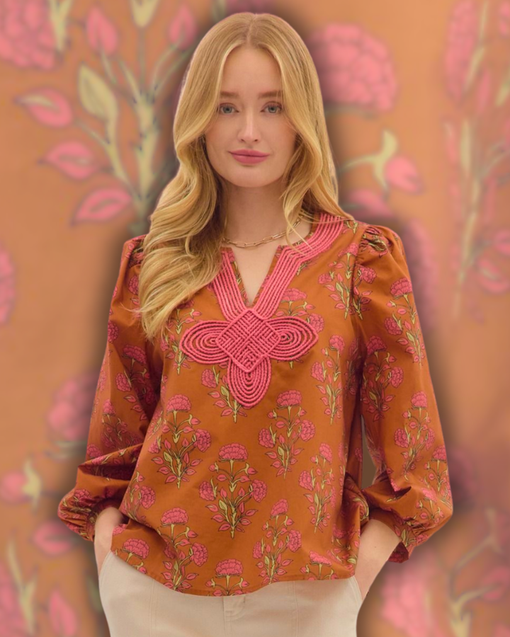 100% cotton Floral print long puff sleeve top featuring contrast embroidered knot trim V-neck