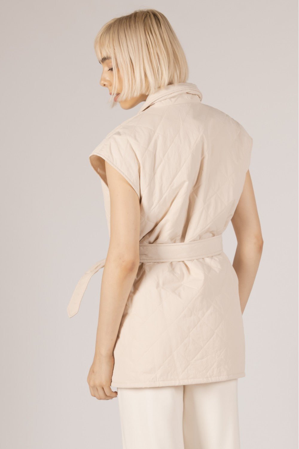 cream quilted belted cap sleeve wrap vest with pockets spring layering