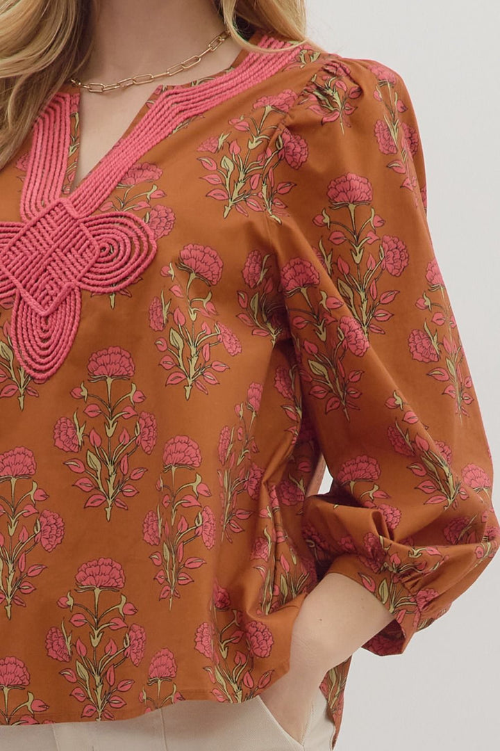  Floral print long puff sleeve top featuring contrast embroidered V-neck