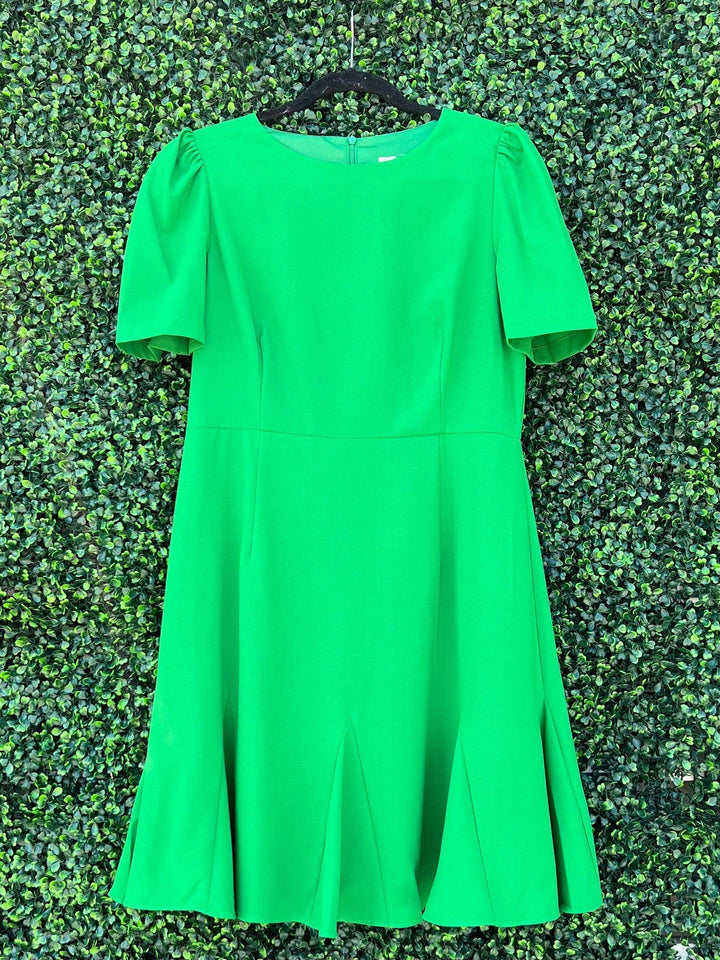 bright green fitted bodice dress with scatter flair at hem in Houston boutique