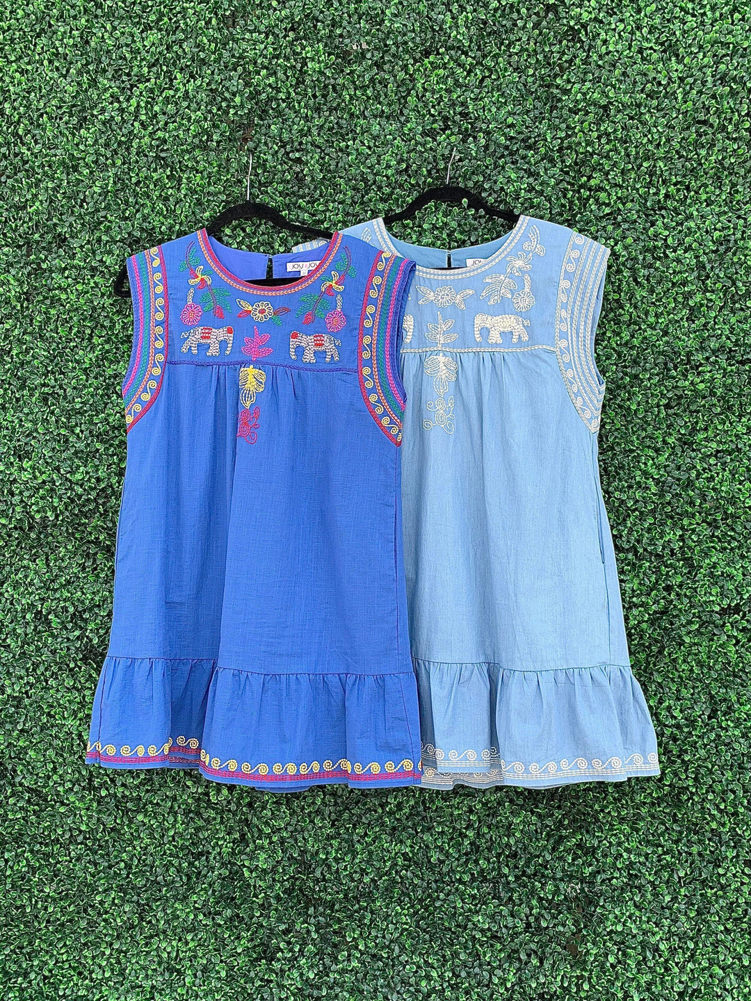 Two colors of the dress from tres Chic with elephants on it