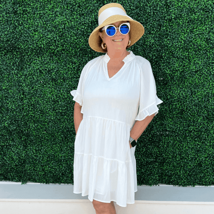 Boutique owner Susan Hancock wearing this light weight summer dress from Tres Chic women's clothing store on Eastside street