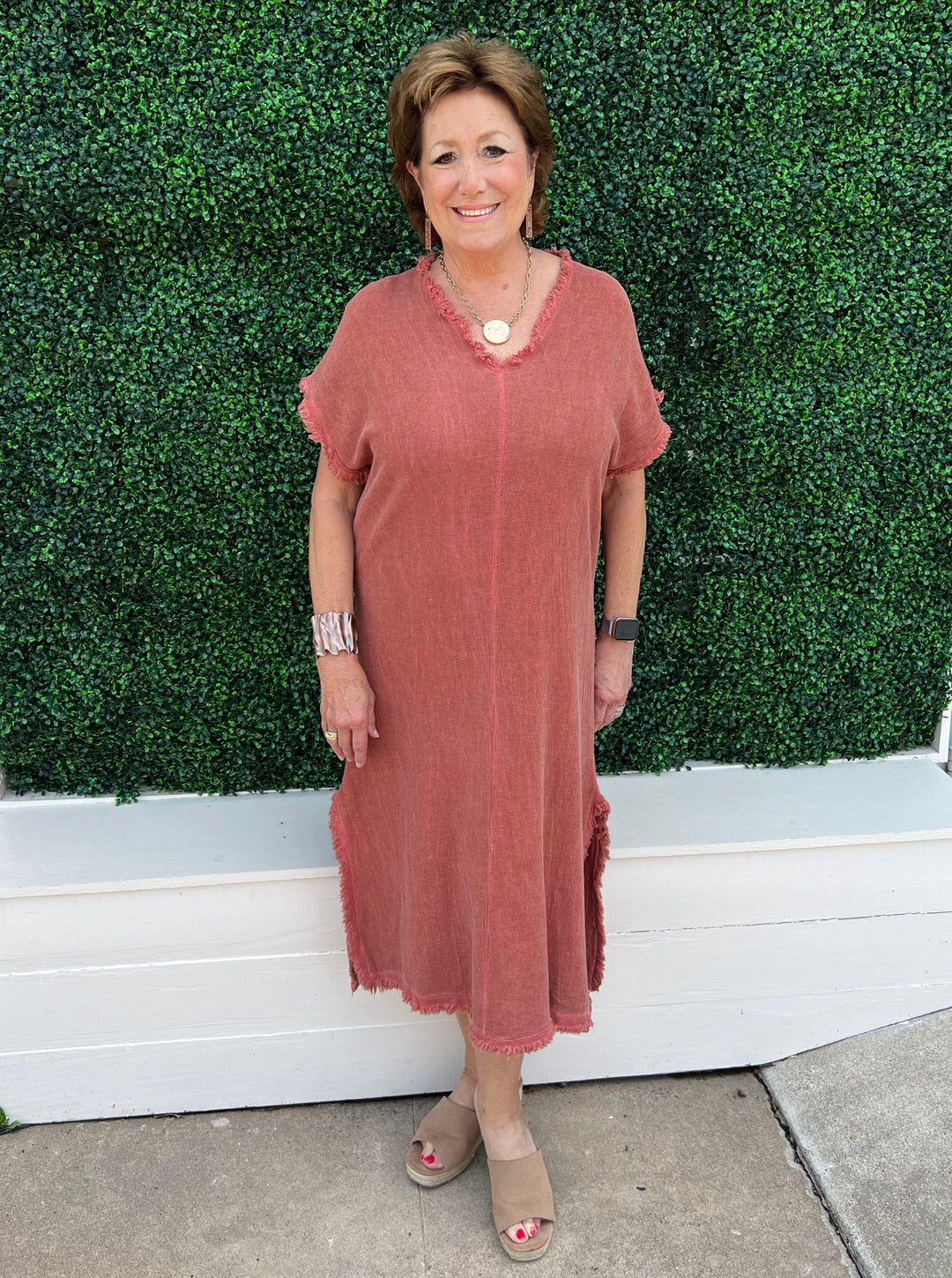 Tres Chic Houston women's store owner wears the new popular dress in brown