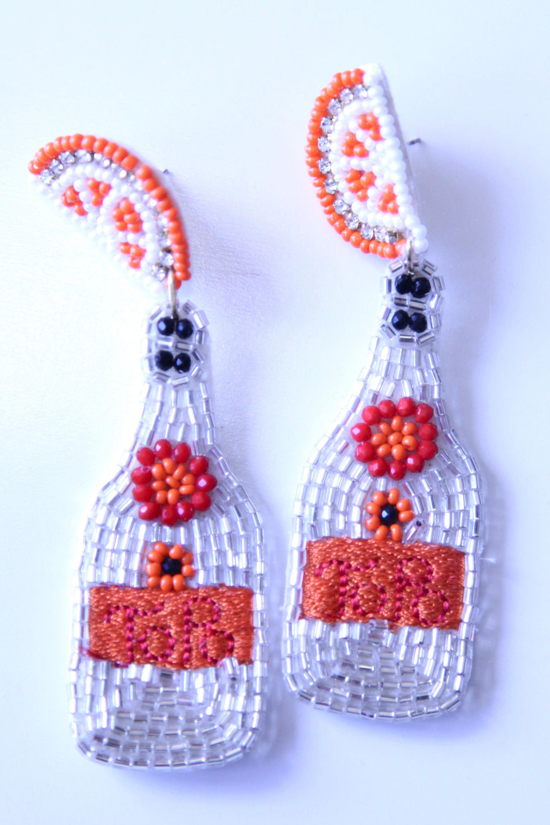orange and white beaded earrings from Houston boutique