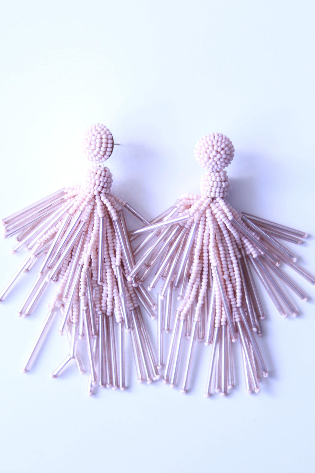 Baby pink beaded earrings available at Tres Chic woman's boutique