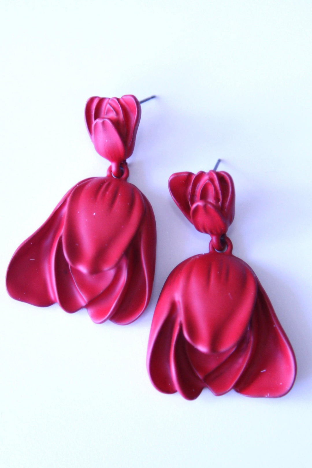 Deep red metal coated flower earrings from online boutique
