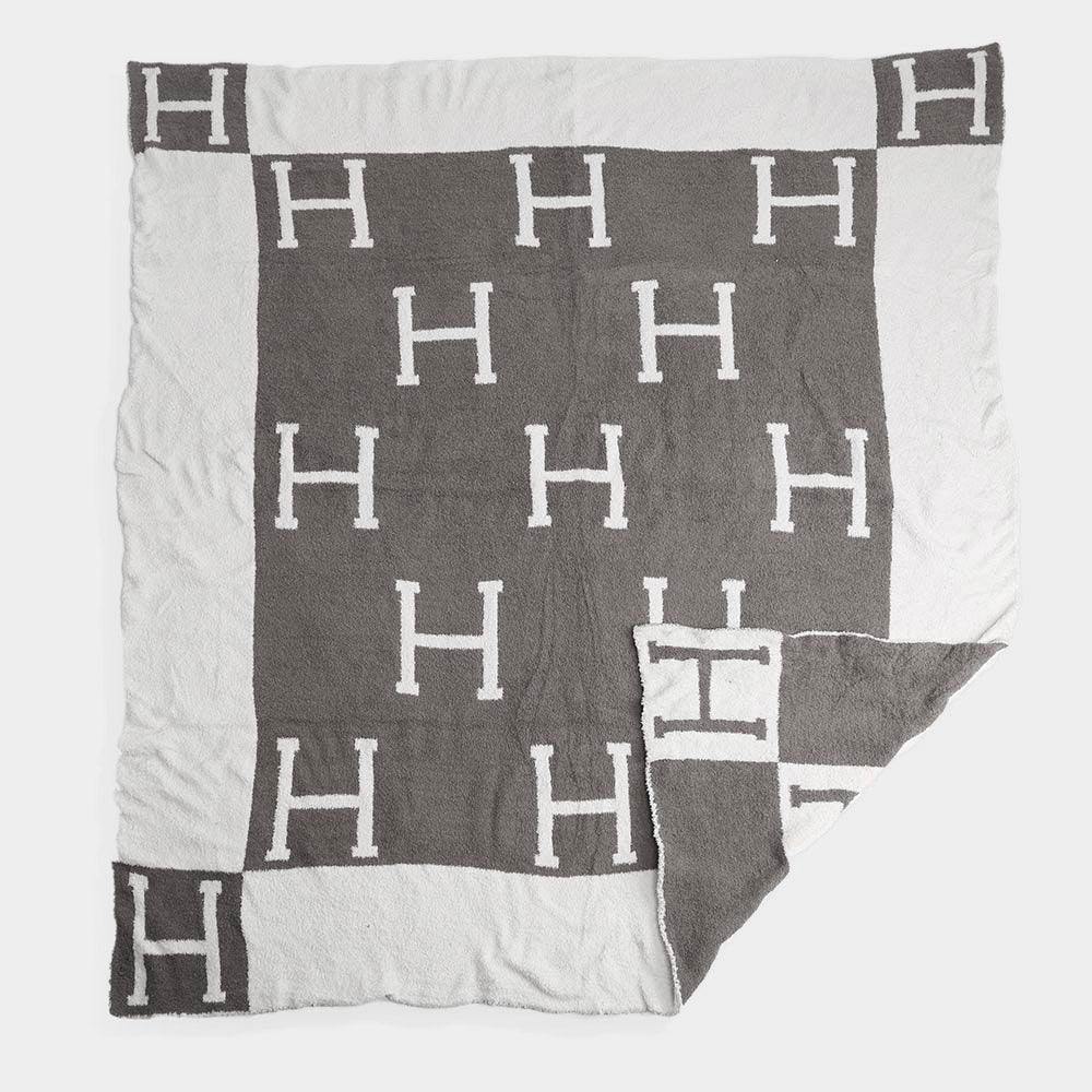 Black blanket similar to hermes in Houston boutique