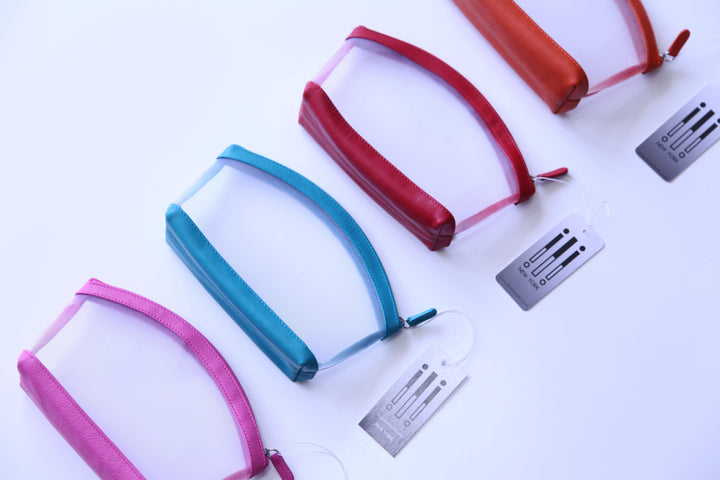 Leather trim zipper pouches in bright colors