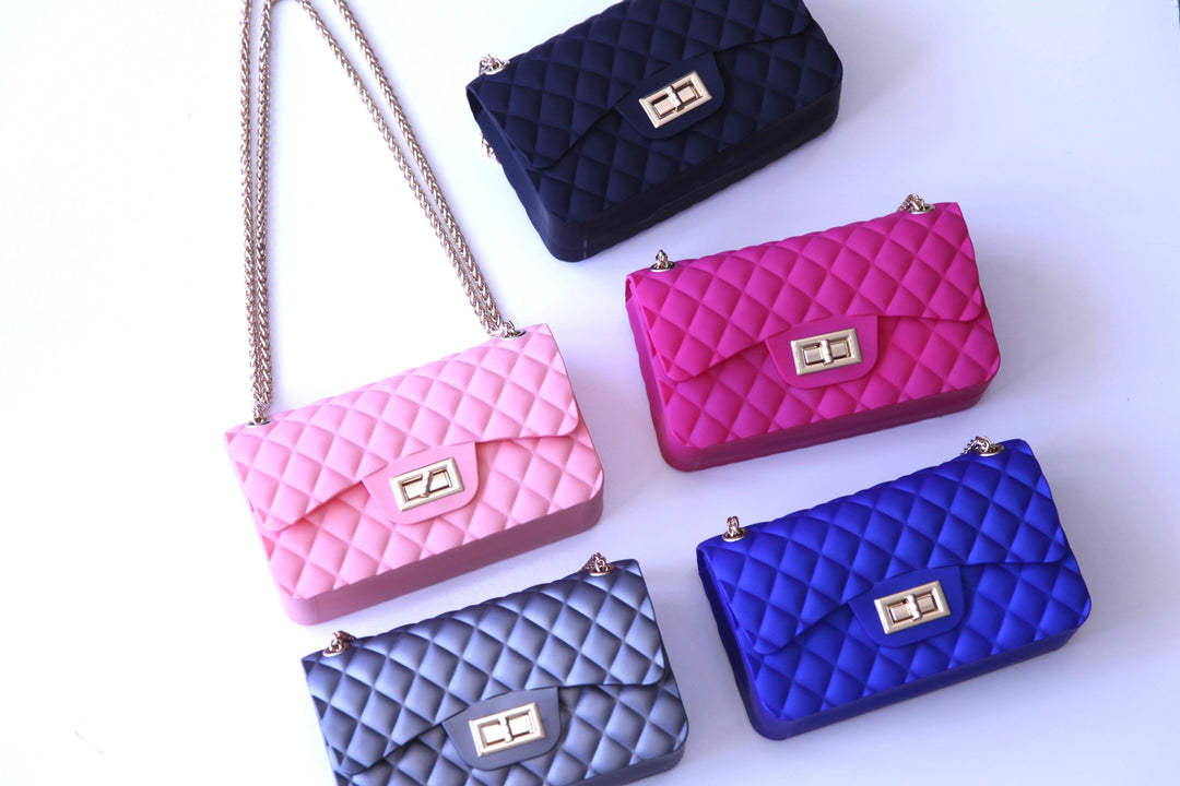 Tres Chic small purses in blue, grey, hot pink, and black