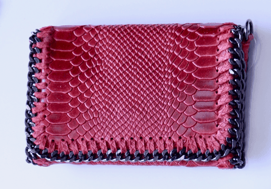 Bright red clutch with chain detail from women's boutique 