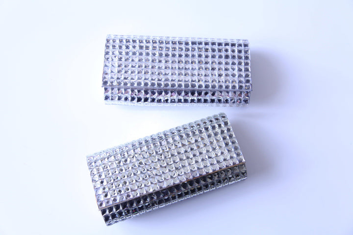 Silver and Gold clutch for formal events from Dress shop in Houston Tres Chic
