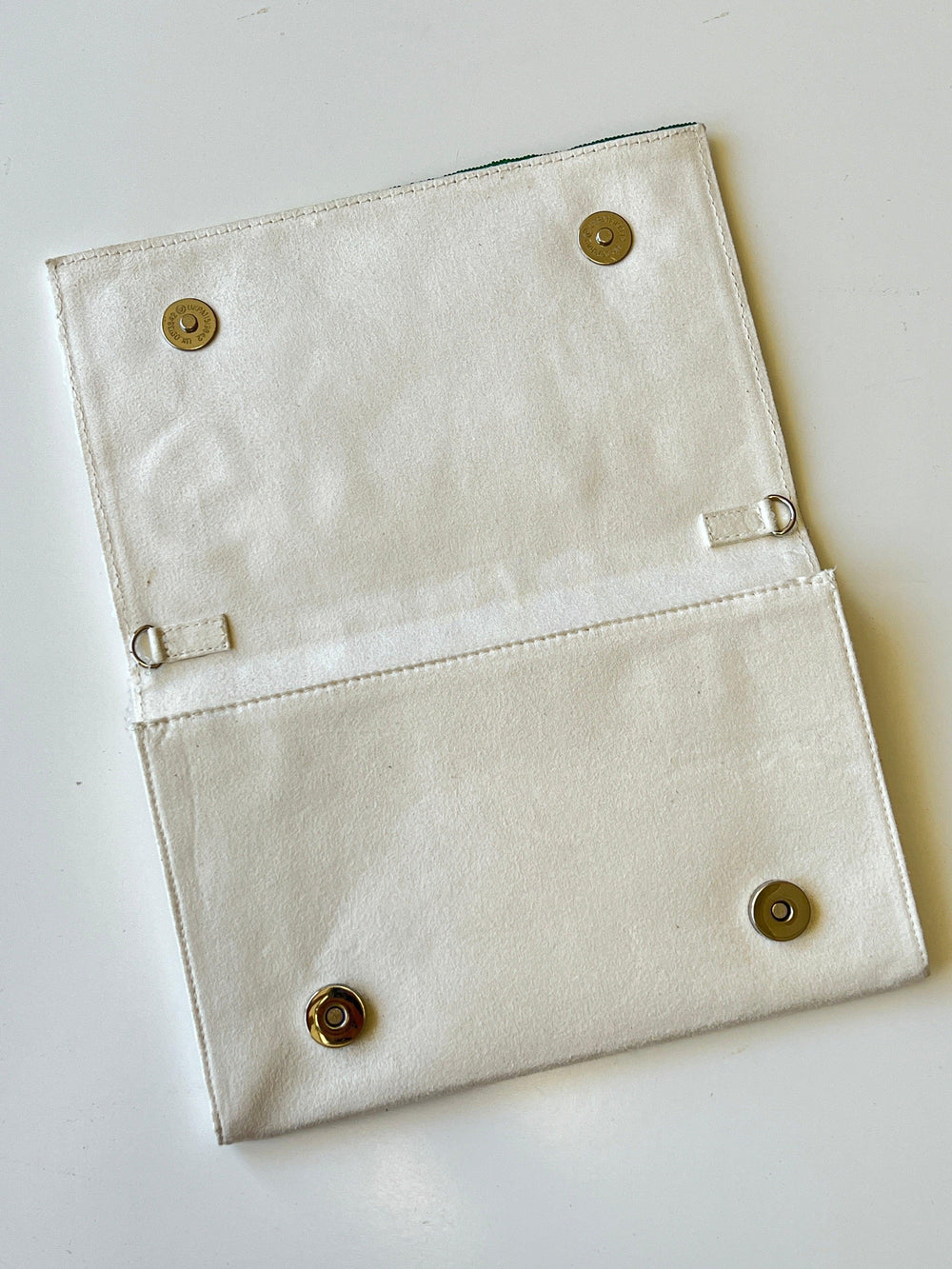 faux suede textured backing on beaded golf clutch 