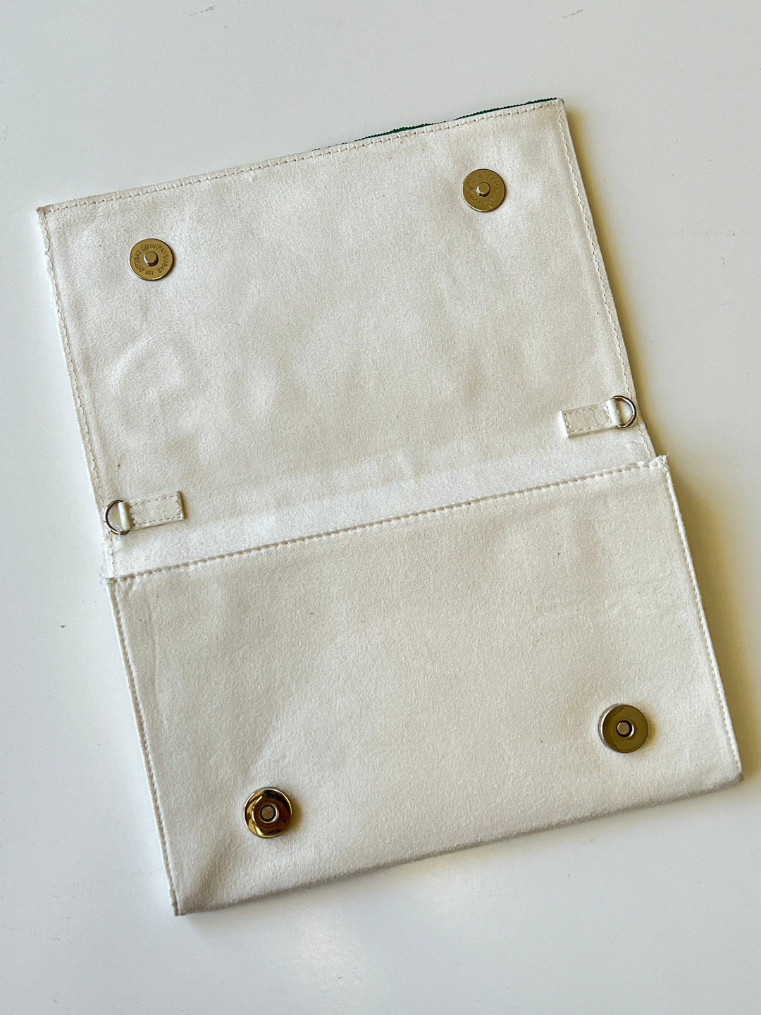 faux suede textured backing on beaded golf clutch 