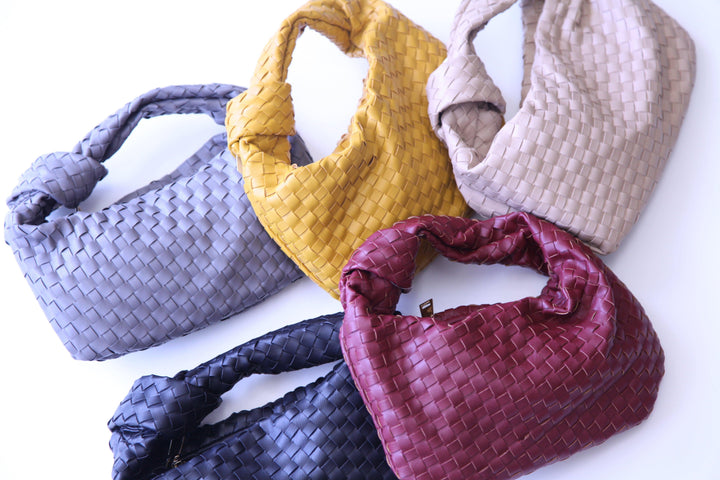 Woven vegan leather handbags with knot detail on handle 
