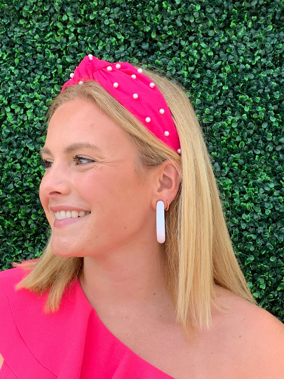 Hot pink headband with pearls in family owned boutique