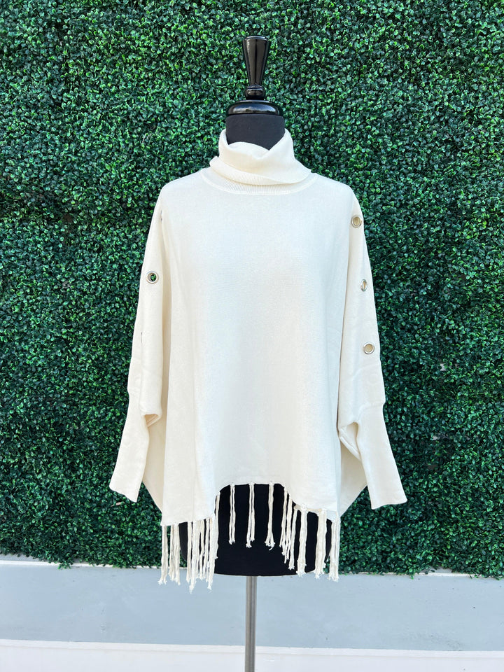 Knit Turtlenck fringed poncho grommets tres chic boutique before you collection