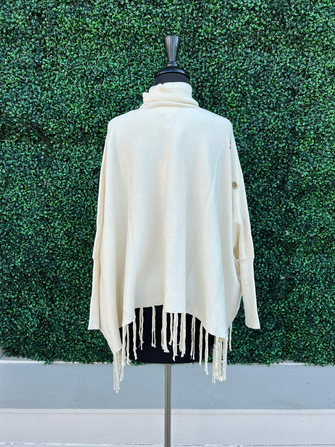 Knit Turtlenck fringed poncho grommets tres chic boutique before you collection cream