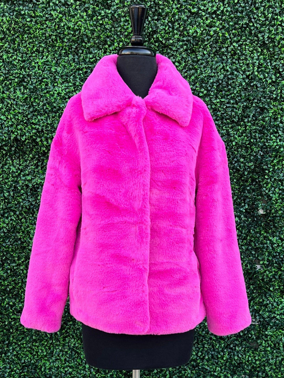 pink fur jacket bee clasp handbag
